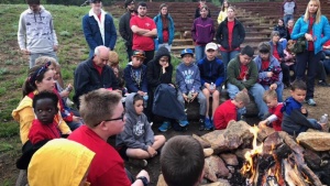 Campers and staff during bonfire time at camp Colorado.