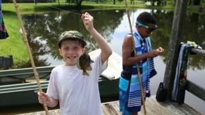 Fishing at Piney Woods preteen camp.