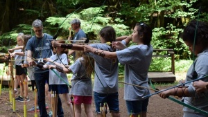 Campers do archery at Northwest preteen camp.