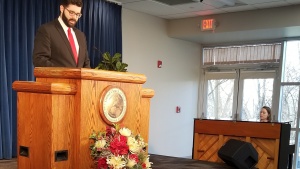 Chad Curran leads songs for the Cincinnati East P.M. service, with Heather Braun playing hymns.