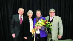 Mr. and Mrs. Kubik standing with Mr. and Mrs. Antion at Winter Family Weekend.