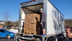 Volunteers from the Cincinnati East congregations regularly spent their Thursday afternoons setting up for the distribution, loading boxes and directing traffic in the drive-through line.