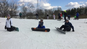 Young adults at the snowboarding activity over the Cincinnati family dance weekend.