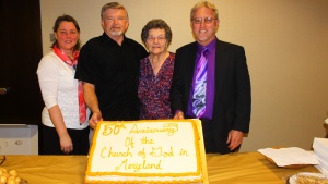 Members of the Maryland church show off the 50th Anniversary cake. 