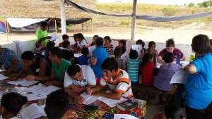 People seated reading Bibles