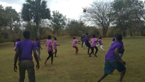 Campers participate in field games at the UYC camp in Verino, Zambia.