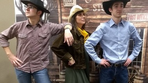 Roundup Trio: Sherry Kenady and her sons Brad and Kurtis strike a playful pose at the Roundup.