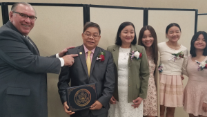 The Htoo family with late pastor Randy D’Alessandro.