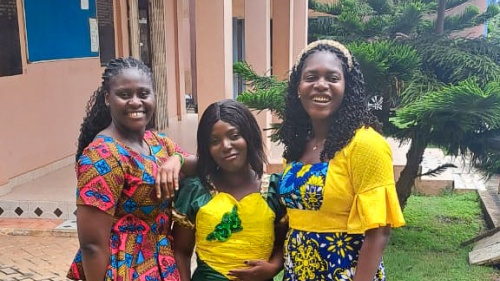 three women standing outdoors