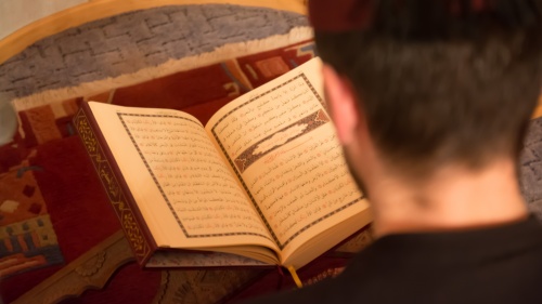 Man reading the Koran