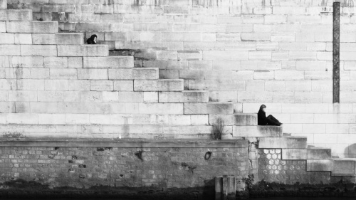 A person sitting on old stairs.