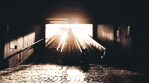 A man walking up stairs.