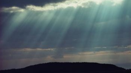 Sunlight rays coming through clouds.
