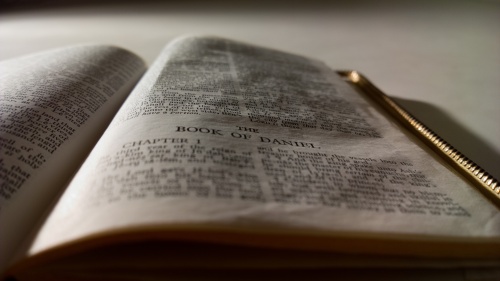 A Bible opened the first chapter of the book of Daniel.