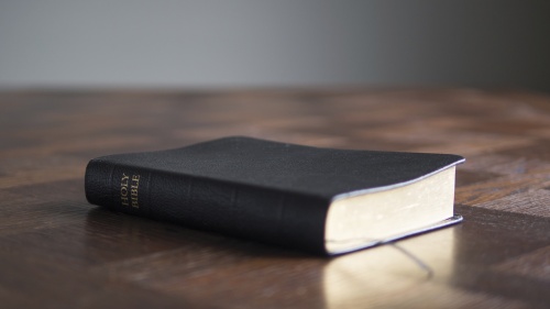 A Bible laying on a table.