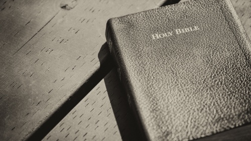 A Bible on a table.