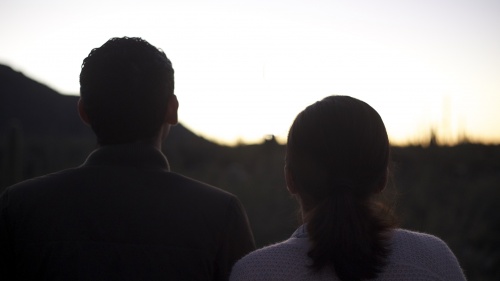 A young couple standing together.