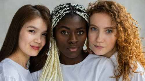 three women with differing skin tones