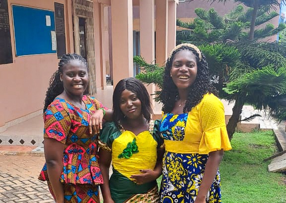 three women standing outdoors