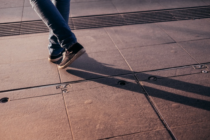 Shadow of a person's legs.