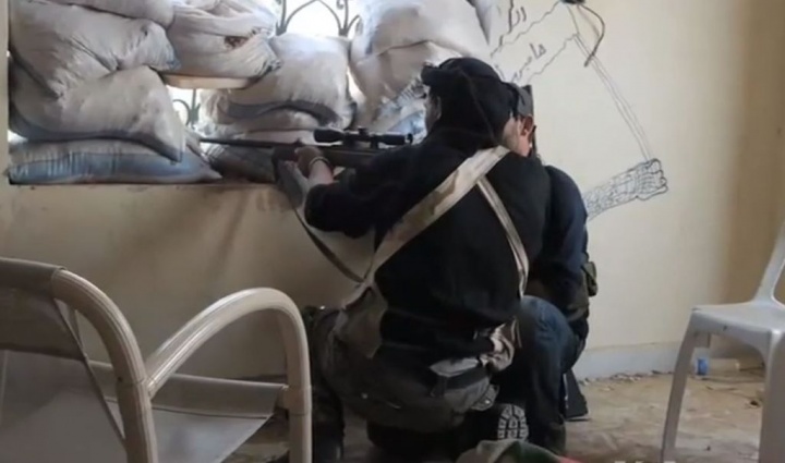 A Syrian rebel sniper in Khan al-Assal, Aleppo province in 2013.