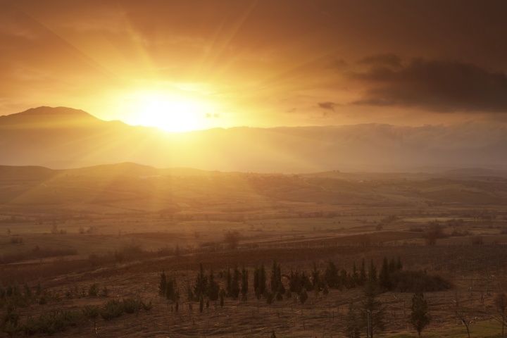 Sunrise over a hill.