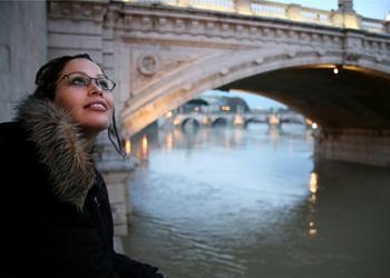 A young woman looking up at the sky.