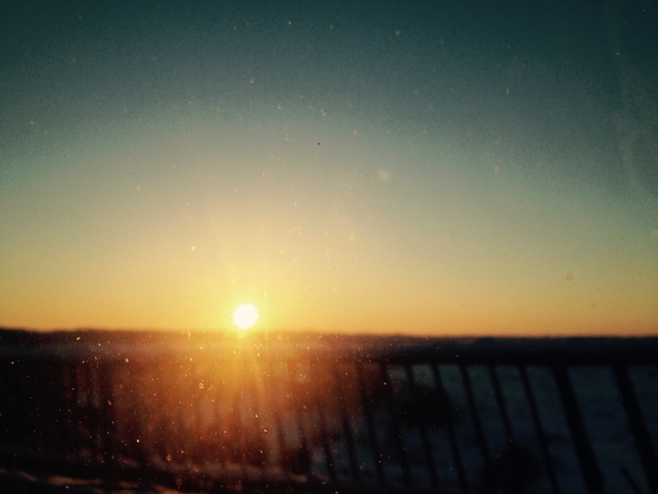 Orange sunset through a glass window.