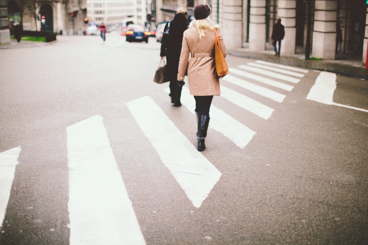 People walking across a street.