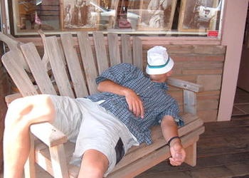 man sleeping on a bench