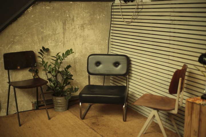 Three empty chairs in a room.