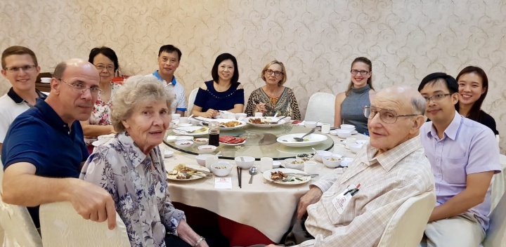 Feastgoers at dinner in Penang, Malaysia.