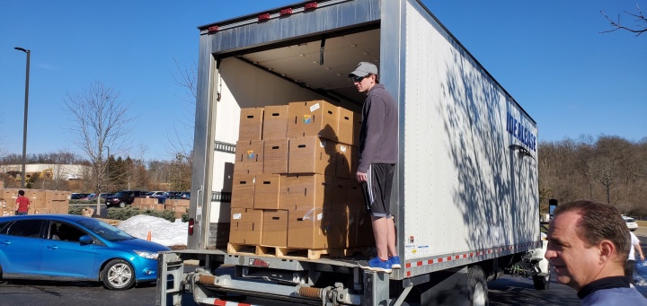 Volunteers from the Cincinnati East congregations regularly spent their Thursday afternoons setting up for the distribution, loading boxes and directing traffic in the drive-through line.