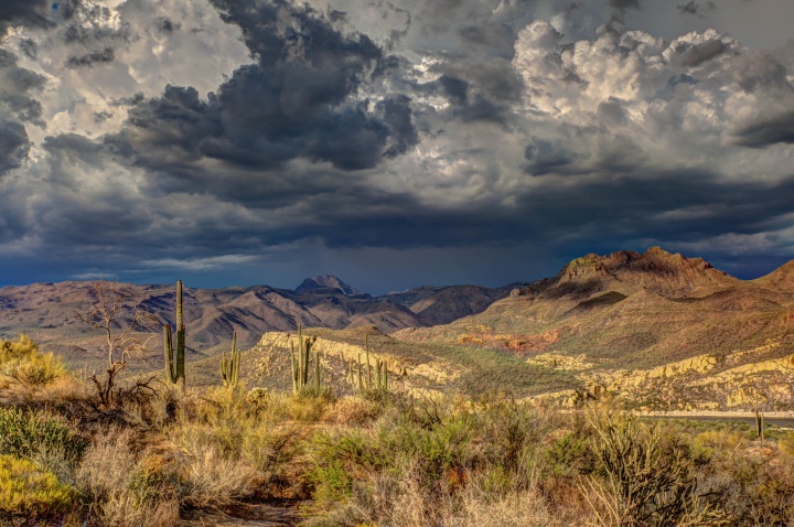 Photo of low clouds and their shadow over the Arizona desert.