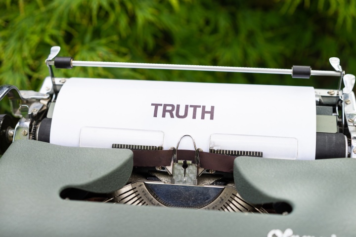 Image of a typewriter with TRUTH on the page.