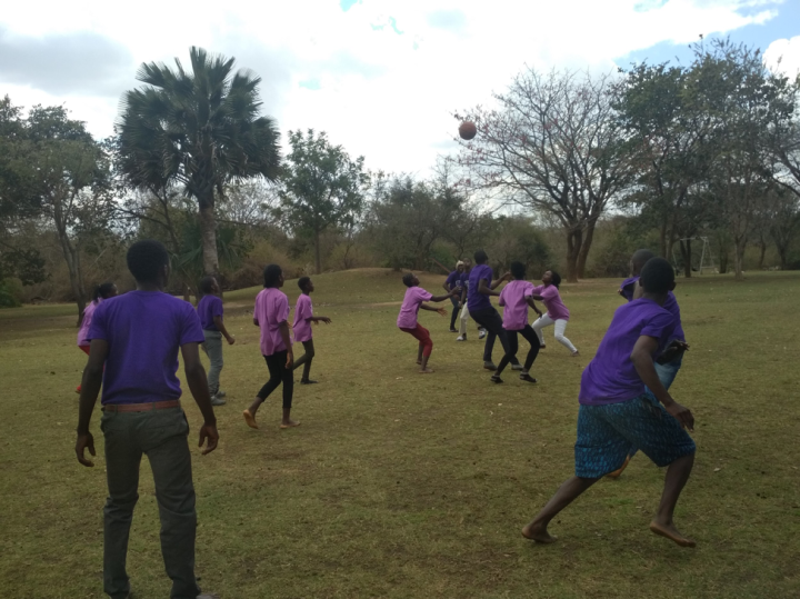 Campers participate in field games at the UYC camp in Verino, Zambia.